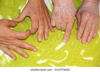 alternative sand therapy, hands of young and elderly women on kinetic sand, rehabilitation after a stroke. - Powered by Shutterstock