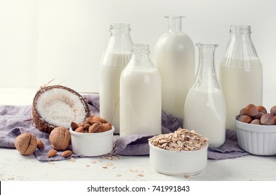 Alternative types of milks in glass bottles. Vegan non dairy milk - Shutterstock ID 741991843