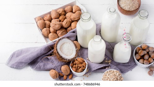 Alternative types of milks in glass bottles. Vegan non dairy milk - Shutterstock ID 748686946