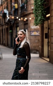 Alternative Woman Smiling While Talking On The Phone Outdoors On The Street.