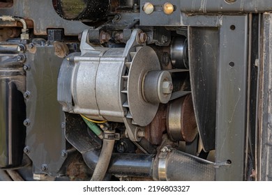 Alternator And Serpentine Belt On Farm Tractor. Agriculture And Farming Equipment Repair, Maintenance And Service Concept