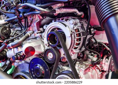 Alternator And Timing Belt Of An Internal Combustion Engine Assembly On A Store Display Case.