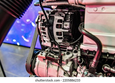 Alternator And Timing Belt Of An Internal Combustion Engine Assembly On A Store Display Case.