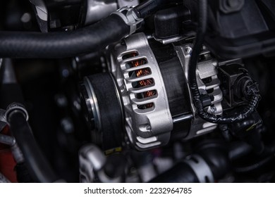 Alternator under the hood of a modern car.  - Shutterstock ID 2232964785