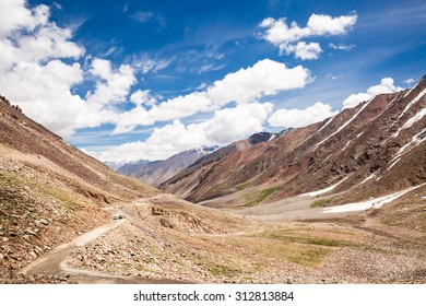 Altitude Road And Snowy Rock Mountain Rage In Summer