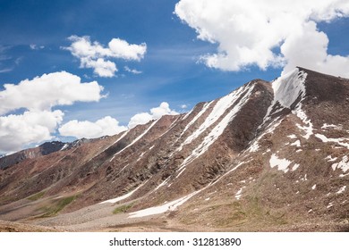 Altitude Road And Snowy Rock Mountain Rage In Summer