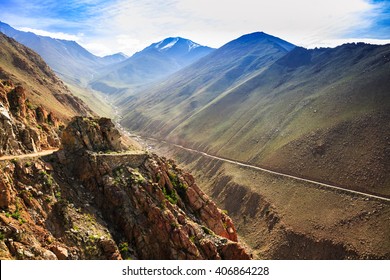 Altitude Road And Snowy Rock Mountain Rage In Summer