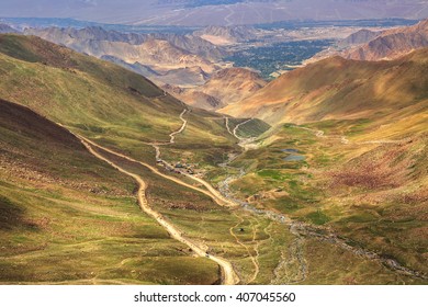 Altitude Road And Snowy Rock Mountain Rage In Summer