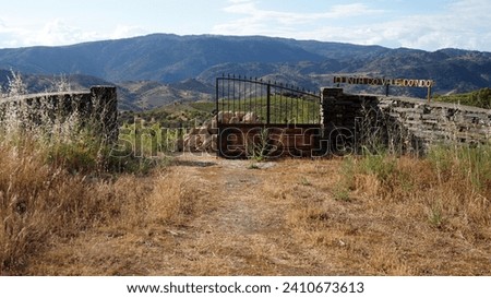 Alto Douro Wine Region, rickety rusty farm gate on a hillside above the Douro Valley, in the district of Braganca, Portugal - May 23, 2023