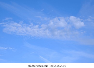 Altocumulus cloud in  a a clear blue sky.