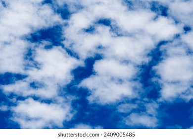 Altocumulus cloud has sproutings in the form of small towers or battlements,  Altocumulus Castellanus with a common base elements base appearing to be arranged in lines in an Australian spring sky.