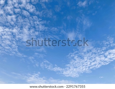 Altocumulus clouds are full of streaks of beautiful usually appear between lower stratus clouds and higher cirrus clouds at Bangkok,Thailand.no focus