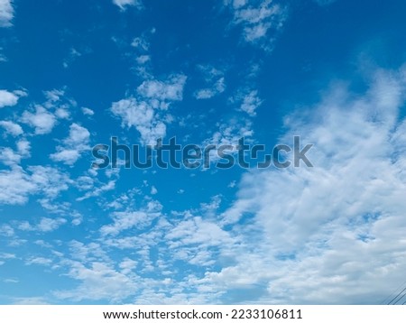 Altocumulus clouds are of water droplets and appear as gray puffy masses and full of streaks of beautiful usually appear between lower stratus clouds and higher cirrus clouds at Bangkok, Thailand.