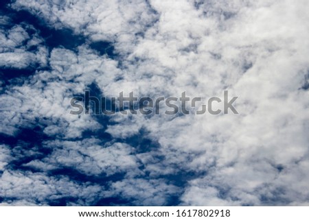 Altocumulus from Latin high and cumulus rounded is a middle-altitude cloud genus that belongs to the stratocumuliform physical category characterized by globular masses or rolls in layers or patches.