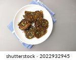 Alu Vadi, Patra, paatra, colocasia leaves roll, Patrode is a popular Indian healthy steamed snack. Garnished with sesame and mustard seeds. copy space.