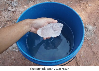 Alum In A Hand. A Type Of Chemical Salt That Is Used To Make The Water Clean And Clear.