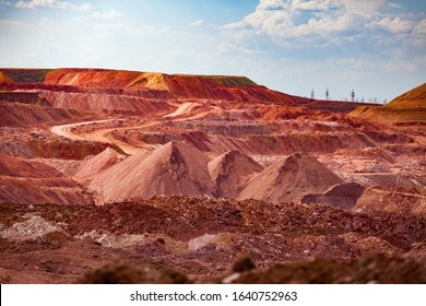 Aluminium Ore Quarry. Bauxite Clay Open-cut Mining. Heaps Of Empty Rocks And Ore.