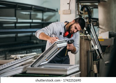 Aluminium and PVC industry worker making PVC or aluminium frames for windows and doors