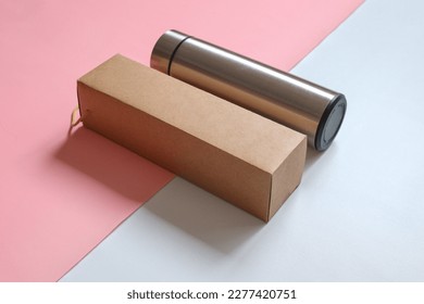 Aluminium reusable steel stainless eco thermo water bottle and box for mockup, isolated on white pink background. Be plastic free. Zero waste.