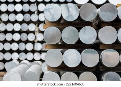 aluminium round bars in outdoor storage - Shutterstock ID 2221604635