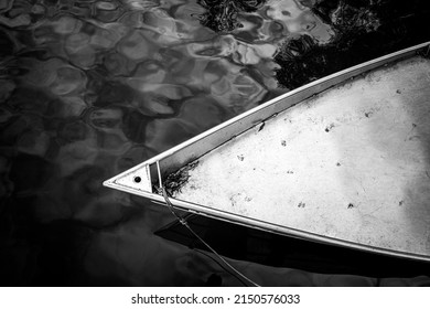 Aluminum boat bow in the water in black   white