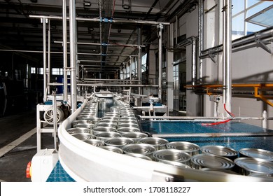 Aluminum Cans For Food Processed In Factory Line Conveyor Machine At Canned Food Manufacturing, Selective Focus
