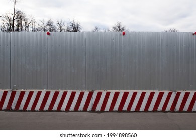 Aluminum Fence On Concrete Blocks. Construction Site Fencing