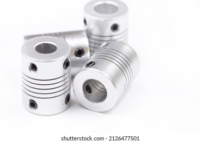 Aluminum flexible cnc shaft couplings isolated above white background. - Shutterstock ID 2126477501