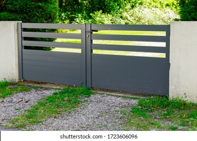 Aluminum home green brown gate portal of suburb house