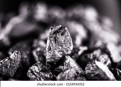 Aluminum nuggets, aluminum is a chemical element of the symbol Al and atomic number 13 with mass 27 u. At room temperature, it is solid, being the most abundant metallic element of the earth's crust. - Shutterstock ID 1524934352