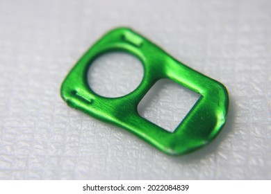 Aluminum Pop Tab Or Ring-pull From A Green Beer Can Widely Used For Recycling