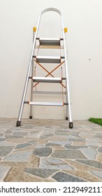 Aluminum Portable Ladders Outside Of The House. 