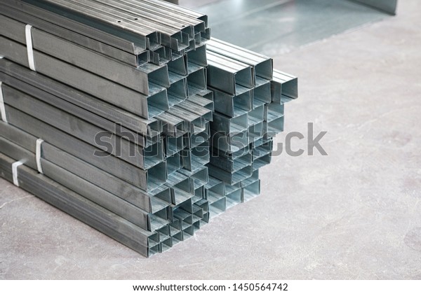 aluminum\
profile for drywall at the construction site, building materials,\
steel profiles for repair, construction\
works