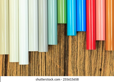 Aluminum Profiles Coated With Powder Coating On Wooden Background