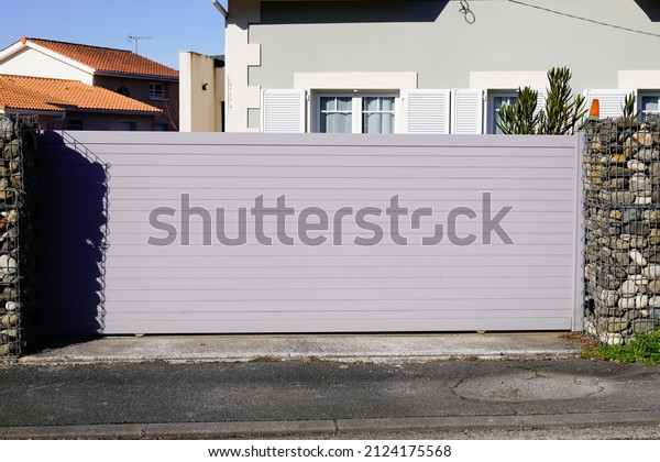 Aluminum sliding door car home in gray gate slide\
high portal of suburb\
house
