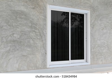 Aluminum Sliding Window On Gray Concrete Wall.