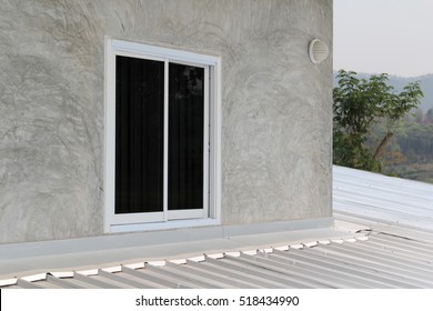 Aluminum Sliding Window On Gray Concrete Wall.