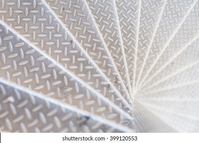 Aluminum spiral steps on a stairway with non-slip pattern. - Shutterstock ID 399120553