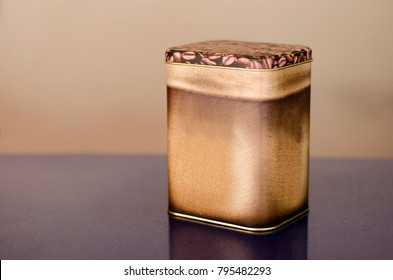 Aluminum Tin Can painted with coffee granules on brown background Canned packaging for coffee or tea, gift box.