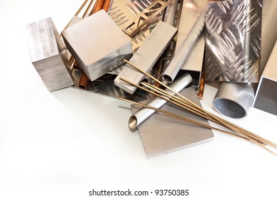 aluminum tubes, profiles, angles, copper and bronze wire on white background - Shutterstock ID 93750385