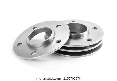 Aluminum wheel spacers  Four through spacers  Isolated white background 