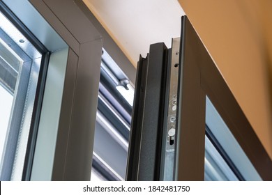 Aluminum Window Detail. Metal Door Frame Open Closeup View. Energy Efficient, Safety Profile, Blur Background