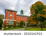 Alumni Hall in College of the Holy Cross with fall foliage in city of Worcester, Massachusetts MA, USA.