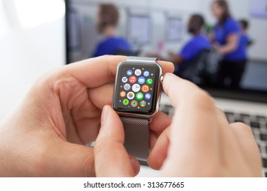 Alushta, Russia - August 29, 2015: Man hand with Apple Watch and app Icon on the screen. Apple Watch was created and developed by the Apple inc.