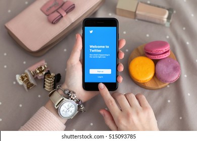 Alushta, Russia - November 11, 2016: Woman Hand With Watch Holding IPhone 7 Jet Black With Social Networking Service Twitter On The Screen. IPhone 7 Was Created And Developed By The Apple Inc.