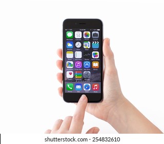 Alushta, Russia - November 14, 2014: Isolated new phone iPhone 6 Space Gray in a woman hand. iPhone 6 was created and developed by the Apple inc.