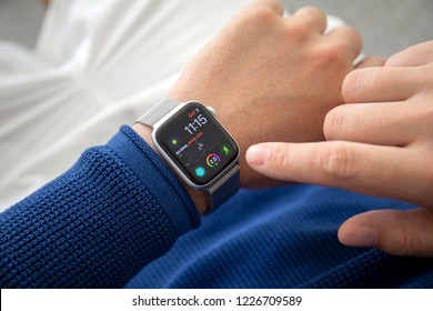 Alushta, Russia - November 3, 2018: Man hand with Apple Watch Series 4 in the home. Apple Watch was created and developed by the Apple inc.