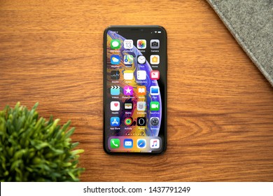 Alushta, Russia - October 13, 2018: IPhone X With Home Screen IOS On The Table. IPhone 10 Was Created And Developed By The Apple Inc.