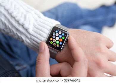Alushta, Russia - October 14, 2015: Man hand and Apple Watch with app on the screen. Apple Watch was created and developed by the Apple inc.