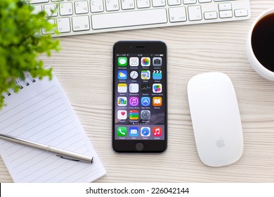 Alushta, Russia - October 25, 2014: New Phone IPhone 6 Space Gray With Apps On Screen Lies On The Table. IPhone 6 Was Created And Developed By The Apple Inc.